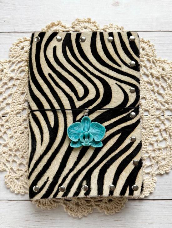 Zoe zebra print journal with silver studs, black elastic and turquoise orchid charm